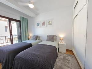 Ένα ή περισσότερα κρεβάτια σε δωμάτιο στο Casa Bonita Cabo Roig - 5 min walk to the beach +33 φωτογραφίες