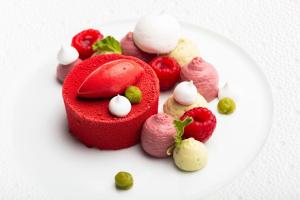 a white plate with a red heart and some fruit at Bella Vista Hôtel, Suites & Maisons in Porticcio +37 photos