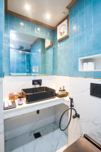 a bathroom with a sink and a mirror at Alaya Stays 6 BHK With Garden - Evaara Woods Hilltop in Shimla +62 photos