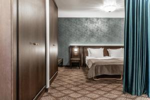 Postel nebo postele na pokoji v ubytování Gradiali Wellness and SPA