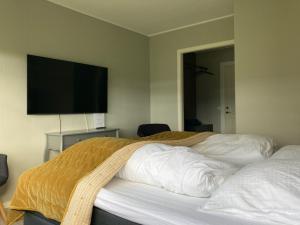 A bed or beds in a room at Møn Golf Resort - Hotel Præstekilde