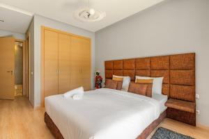 Ένα ή περισσότερα κρεβάτια σε δωμάτιο στο Elegant Apartment in Prestigia Golf Marrakech +28 φωτογραφίες