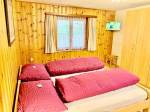 Postel nebo postele na pokoji v ubytování Chalet Medi
