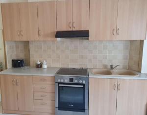 a kitchen with a stove and a sink at Modern Apartment I & II by Irida Iris Group in Mytilene +2 photos