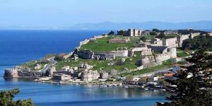 a castle on an island in the water at Modern Apartment I & II by Irida Iris Group in Mytilini