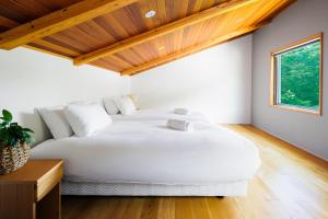 Ένα ή περισσότερα κρεβάτια σε δωμάτιο στο Wagaya Chalet by HHG