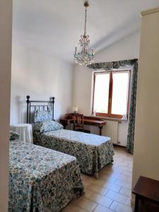 Ένα ή περισσότερα κρεβάτια σε δωμάτιο στο I Gelsi di Colombata Locazione turistica breve in campagna