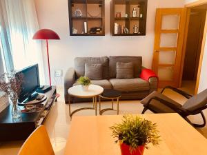 a living room with a couch and a table at Galicia - Porto de Espasante - Ortigueira in O Porto de Espasante