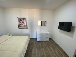 Ένα ή περισσότερα κρεβάτια σε δωμάτιο στο Casa Vancanze BELLAVISTA