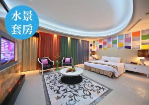a hotel room with a bed and a tv at Lanshy Motel in Taichung +48 photos