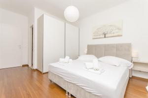 En eller flere senge i et værelse på Apartment Tonkica