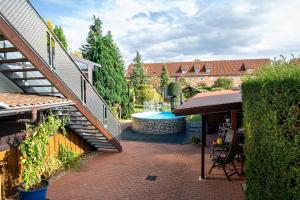 an outdoor patio with a swimming pool and a staircase at Ferienwohnung Fred in Warenshof