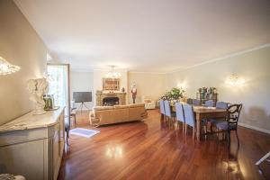 a living room with a table and a dining room at Domus Fontis Pescaia in Spoleto