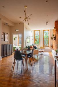 a large living room with a table and chairs at The Getaway in DT Northfield! in Northfield