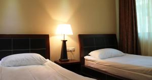 Postel nebo postele na pokoji v ubytování Dilijan Park Resort & Villas