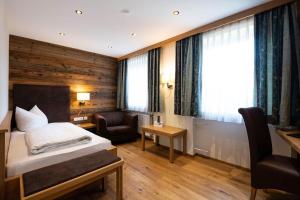 Postel nebo postele na pokoji v ubytování Hotel Randsbergerhof