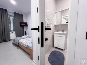 Ένα ή περισσότερα κρεβάτια σε δωμάτιο στο RentHouse Apartments NanoFlat #4 +16 φωτογραφίες