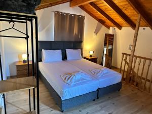 Postel nebo postele na pokoji v ubytování Casa di Mare e Giardino, Agios Stefanos, Corfu