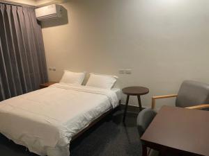 Voodi või voodid majutusasutuse 金門民宿 獺上小島民宿 文旅 青旅 toas