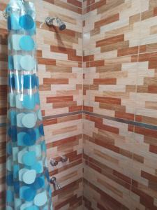 a bathroom with a shower with a glass door at Don Jose in Piquete +5 photos