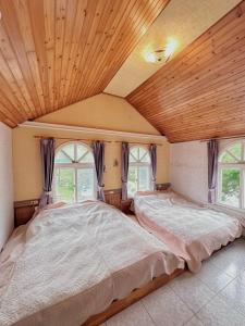 Krevet ili kreveti u jedinici u okviru objekta 晨曦山莊 晨曦紅瓦厝國民旅遊卡特約商店Sunshino farmstead