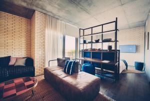 a living room with a couch and a bed at South Congress Hotel in Austin