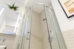 a shower with a glass door in a bathroom at The Lanes Royale - Rose Platinum Properties in Brighton & Hove