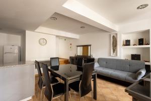 a living room with a table and a couch at Casa Amarela - Serra da Estrela Portugal in Verdelhos