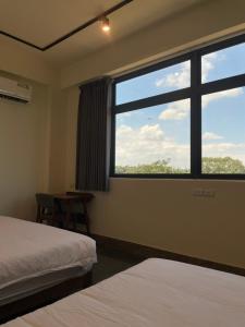 Voodi või voodid majutusasutuse 金門民宿 獺上小島民宿 文旅 青旅 toas