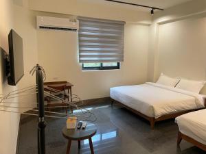 Voodi või voodid majutusasutuse 金門民宿 獺上小島民宿 文旅 青旅 toas