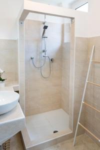 a bathroom with a shower and a sink at C004 - Camerano, nuovo bilocale con aria condizionata in Camerano +11 photos