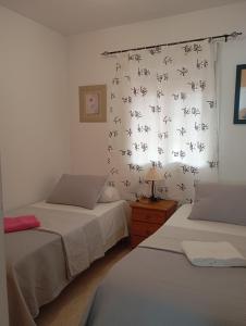 Postel nebo postele na pokoji v ubytování Zona Marina Dor - Apartamentos Costa Caribe II