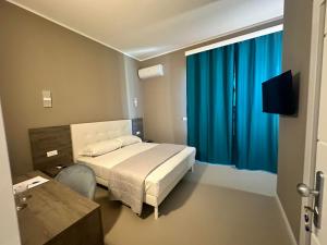 Voodi või voodid majutusasutuse Sunset Guest House toas
