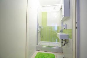 a bathroom with a shower and a sink at Apartment Hurcak in Zagreb