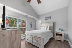 En eller flere senge i et værelse på Purple Paradise + 25 billeder