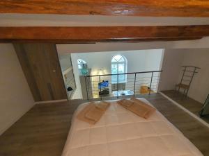a bedroom with a large bed in a attic at Casa Bortolin in Domodossola