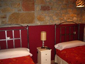 A bed or beds in a room at Hotel La Pradera de Marta