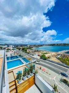 a view of the water from a balcony of a building at Résidence Cazino Apartamentos in Praia