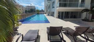 a swimming pool in the middle of a building at Boca del Mar III, Boca Chica in Boca Chica