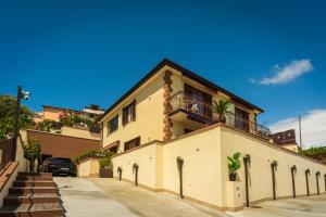 a building with a balcony on top of it at Casa Vacanze - Residence Villa Don Salvatore in Agropoli