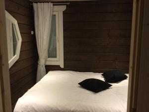 Säng eller sängar i ett rum på Nellim Holiday Home