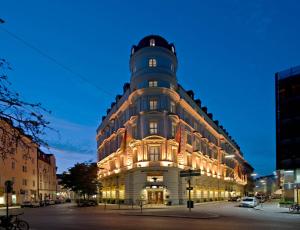 a building with a tower on top of it at Mandarin Oriental, Munich in Munich