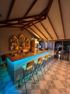 a bar with a row of chairs in a restaurant at Casablanca Hotel in Dalyan
