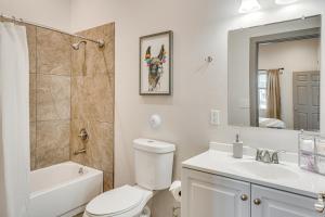 a bathroom with a toilet and a sink and a shower at Private Patio Townhome By University of Arizona! in Tucson +20 photos