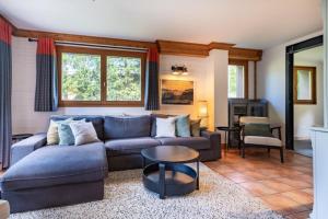 a living room with a couch and a table at Chalet Matterhorn in Mussillon