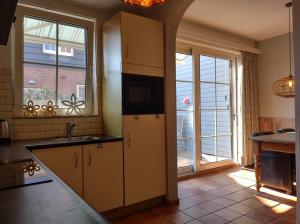 Η κουζίνα ή μικρή κουζίνα στο ASTERIAS Bed by the Sea