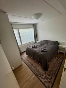 Ένα ή περισσότερα κρεβάτια σε δωμάτιο στο Saunallinen & rauhallinen asunto