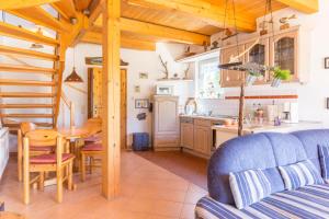 a kitchen and dining room with a table and a kitchen at Ginster in Zingst