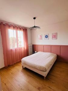 Ένα ή περισσότερα κρεβάτια σε δωμάτιο στο Appartement bohème