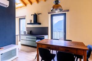 a kitchen with a table and chairs and a window at Casale Bellavista 1853, Cremia, Lago di Como in Cremia +48 photos